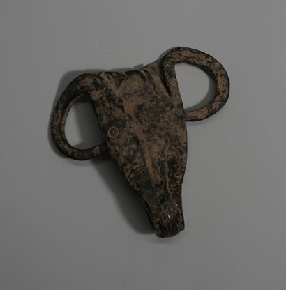 Brown bronze zoomorphic idol head representing...
