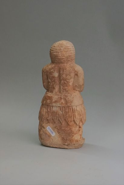 Statuette of a priest in stone (alabaster?),...