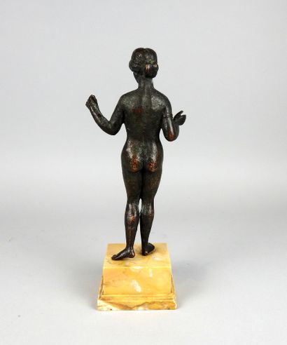 Very large statuette representing Venus holding...