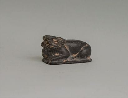 Reclining lion in black soft stone, Near...