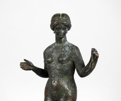 Very large statuette representing Venus holding...