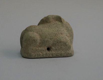 Small curved caprid in greenish brown stone....