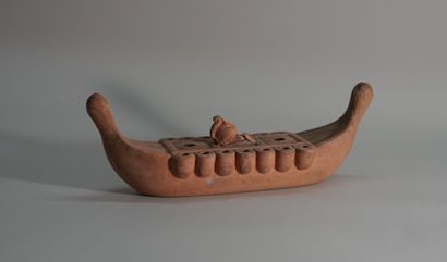 Terracotta oil lamp in the shape of a boat....