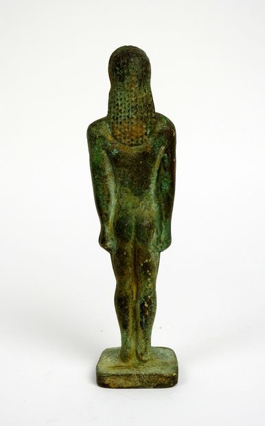 Large kouros with arms at the side of the...