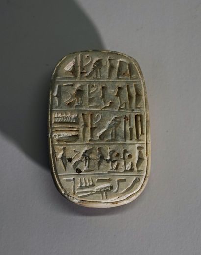 Beige hardstone scarab, incised with hieroglyphs...