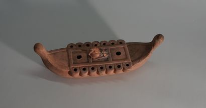Terracotta oil lamp in the shape of a boat....