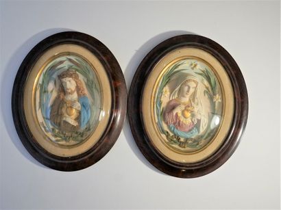 Pair of painted plaster bas-reliefs representing...