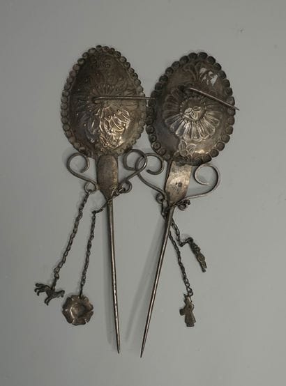 Set of two large decorative silver fibulas...