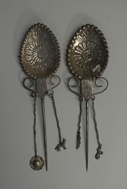 Set of two large decorative silver fibulas...