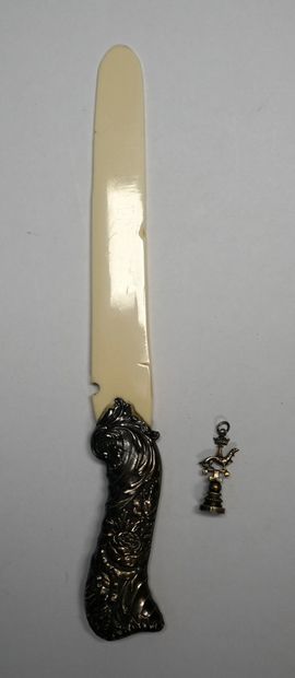 
PAPER CUTTER , the silver handle decorated...
