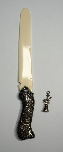 
PAPER CUTTER , the silver handle decorated...