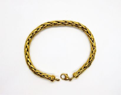 BRACELET in 18K (750/°°) yellow gold, palm...