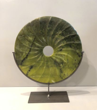 Chinese bi disc on black metal stand. A scholar's...