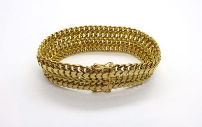 BRACELET in 18K (750/°°) yellow gold, double...