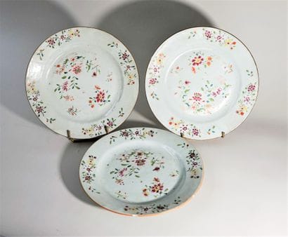 Nine white porcelain plates with polychrome...