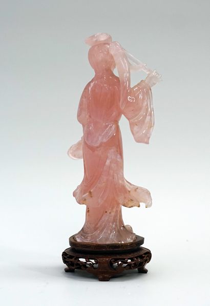 Rose quartz gwanyn holding fruits. China,...
