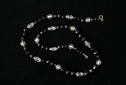 SAUTOIR composed of faceted crystal beads...