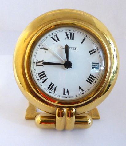 CARTIER - MUST Travel alarm clock. Gilt brass...
