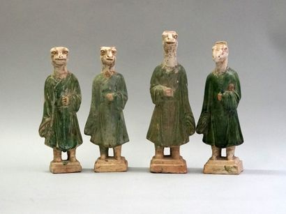 Twelve figures of a procession with heads...