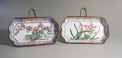 Two enamelled copper dishes decorated with...