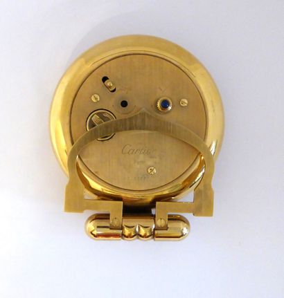 CARTIER - MUST Travel alarm clock. Gilt brass...