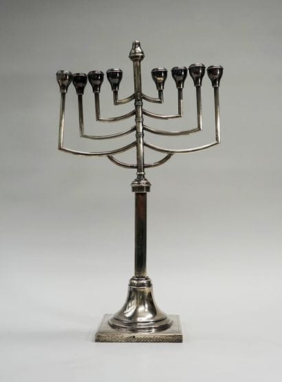 An 800° silver articulated hannoukia, the...