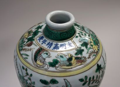 Porcelain vase with green, turquoise, yellow...
