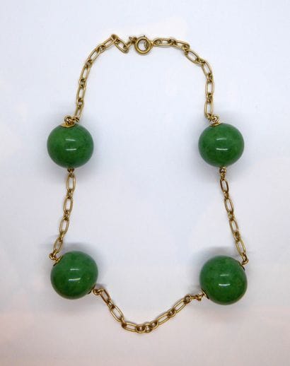 NECKLACE in 18K (750/°°) yellow gold adorned...