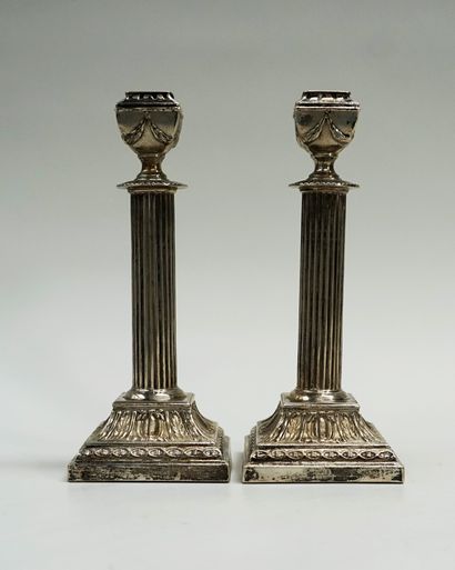Pair of silver candlesticks 800/°°, the shaft...