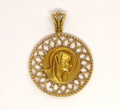 Religious medal in 18K yellow gold (750/°°)...