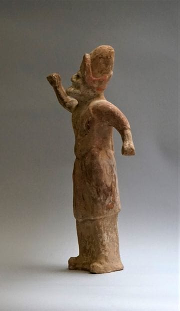 Beige terracotta shaman with white, red and...