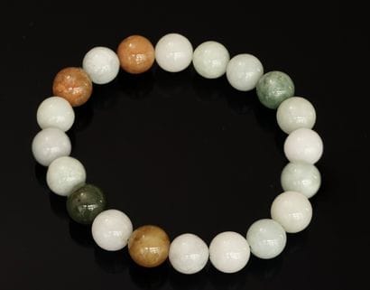 BRACELET of jade balls, about 10mm, mounted...