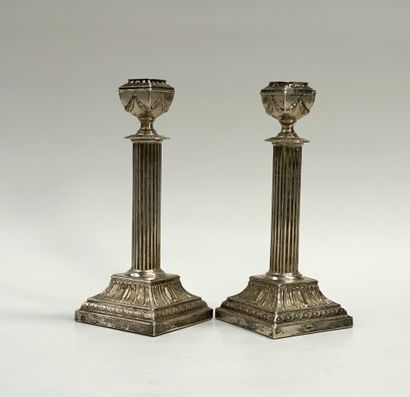 Pair of silver candlesticks 800/°°, the shaft...