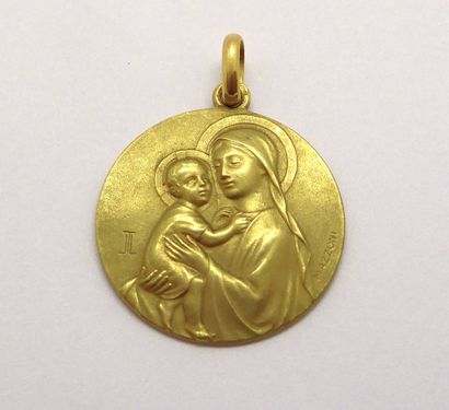 Religious medal in 18K (750/°°) yellow gold...