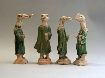 Twelve figures of a procession with heads...