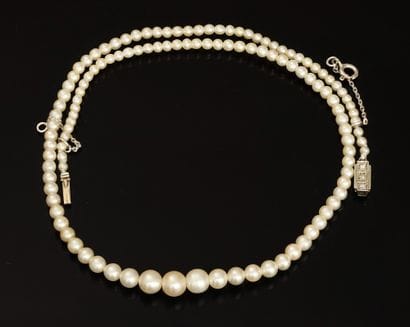 NECKLACE of pearls in fall made up of fine...