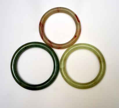 Three green (jadeite) and translucent red...
