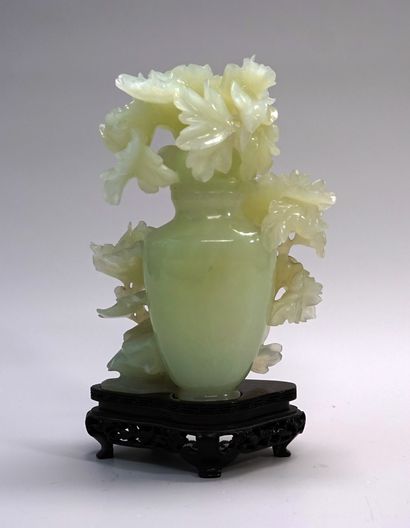 Covered serpentine pot decorated with branches...