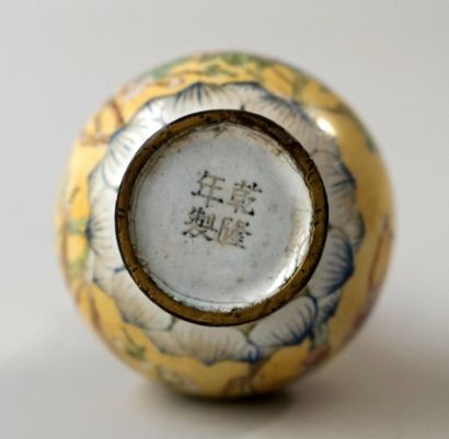 Small enamelled copper vase with floral decoration....