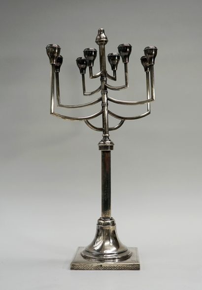 An 800° silver articulated hannoukia, the...