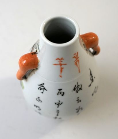 Small porcelain vase decorated with an old...