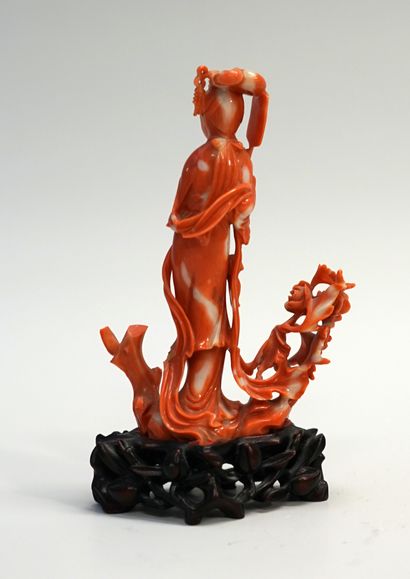 Young woman with a fan in orange red coral....