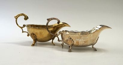 Set of 2 sauce boats, one in brass, the other...
