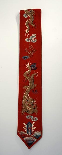 Vertical silk headband embroidered with golden...