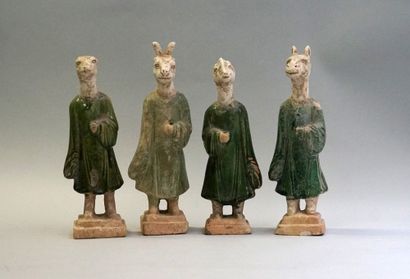 Twelve figures of a procession with heads...