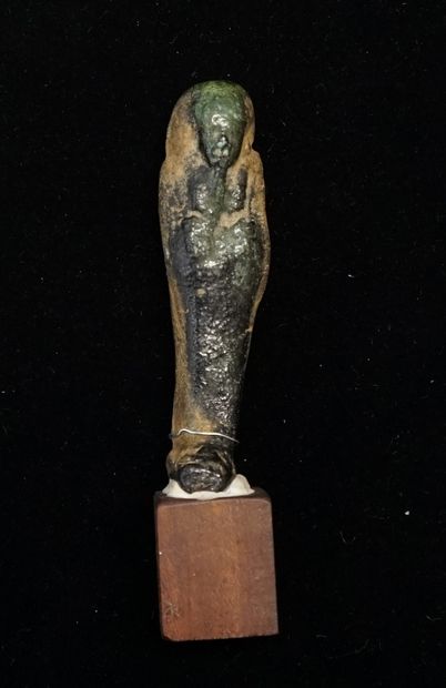 Dark green enamelled frit oushebti from the...