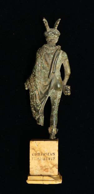 Mercury standing on a marble base. He is...