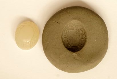 Hard stone oval cabochon slightly iridescent,...