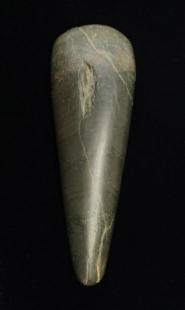 Beautiful polished axe in green stone. (a...