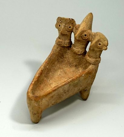 Cup with three stylized bird heads. Beige...